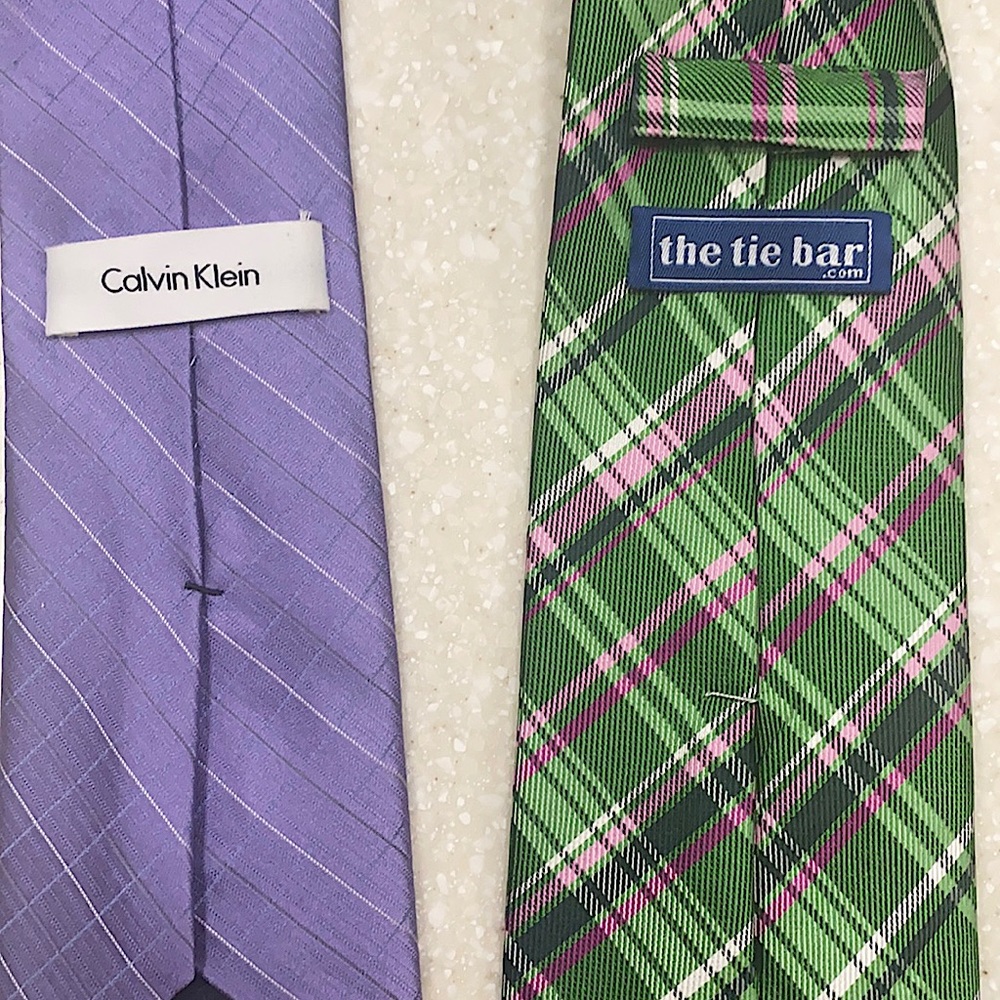 One Calvin Klein brand tie. One green multi color tie from The Tie bar.